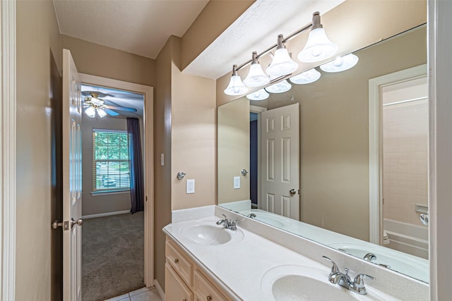 13219 Allysum Ct, Cypress, TX 77429 - bathroom with double vanity,  shower combination, ceiling fan, and tile patterned flooring