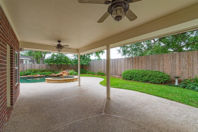 13219 Allysum Ct, Cypress, TX 77429 - fenced backyard featuring ceiling fan, a patio area, and a pool with connected hot tub
