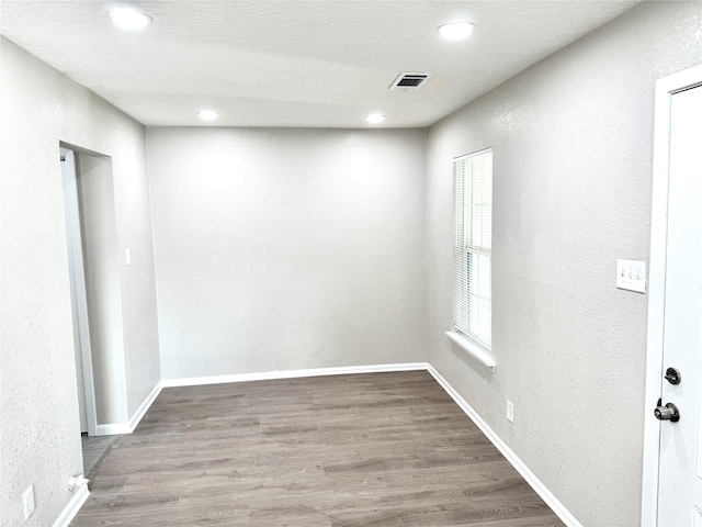 3514 Mattye Maye Dr, Pasadena, TX 77503 - spare room with a textured wall, wood finished floors, recessed lighting, and baseboards
