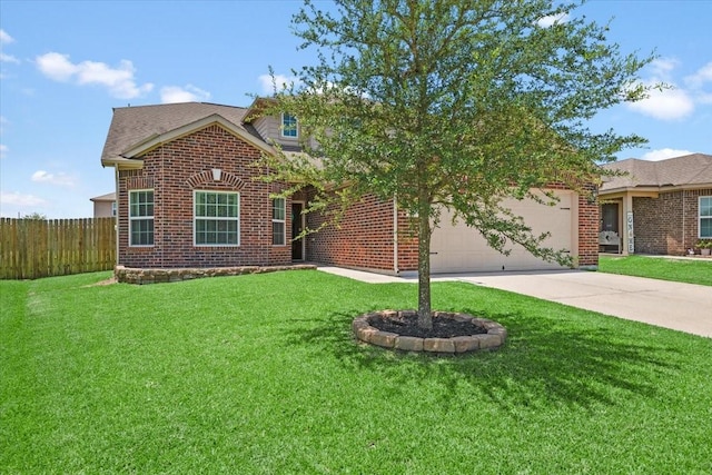 22435 Base Light Dr, Hockley, TX 77447 - view of front of home with concrete driveway, a garage, and brick siding