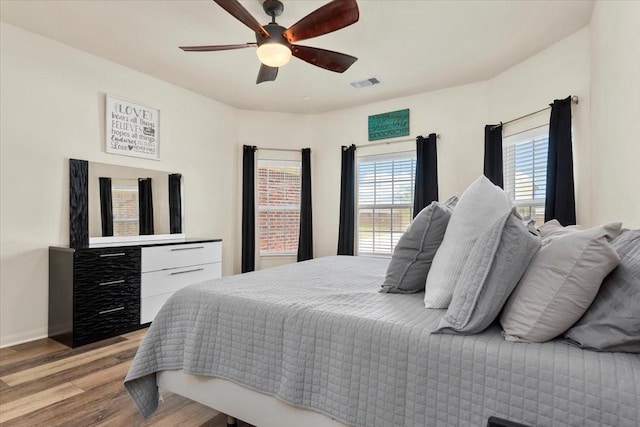 22435 Base Light Dr, Hockley, TX 77447 - bedroom featuring light wood-type flooring and ceiling fan