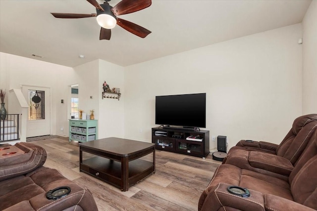 22435 Base Light Dr, Hockley, TX 77447 - living room with light wood finished floors and ceiling fan