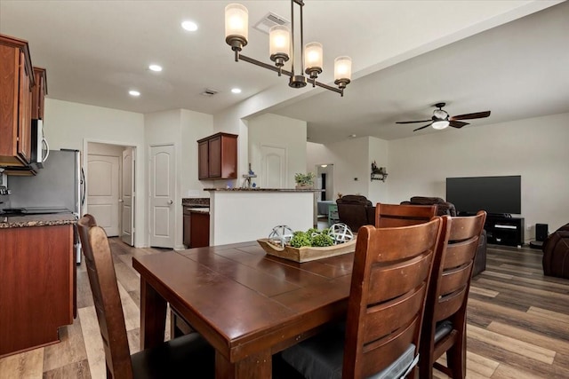 22435 Base Light Dr, Hockley, TX 77447 - dining space featuring a ceiling fan, recessed lighting, and wood finished floors