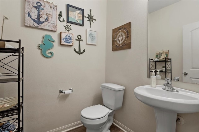 22435 Base Light Dr, Hockley, TX 77447 - half bath featuring toilet and wood finished floors