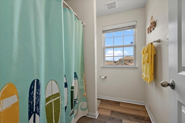 22435 Base Light Dr, Hockley, TX 77447 - bathroom featuring wood finished floors and baseboards