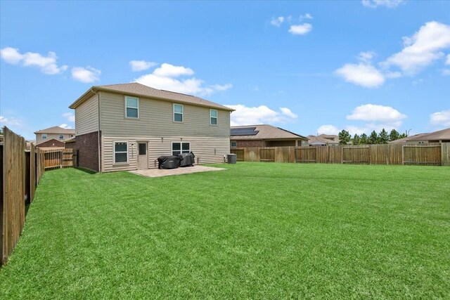 22435 Base Light Dr, Hockley, TX 77447 - back of property featuring a patio and a fenced backyard