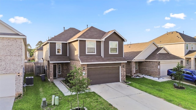 4831 Blue Jacaranda Way, Spring, TX 77373 - view of front of house with brick siding, roof with shingles, central AC unit, driveway, and an attached garage