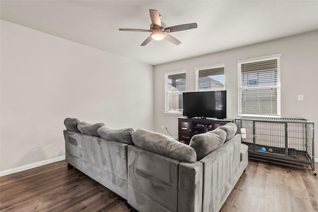 4831 Blue Jacaranda Way, Spring, TX 77373 - living room featuring wood finished floors, baseboards, healthy amount of natural light, and ceiling fan