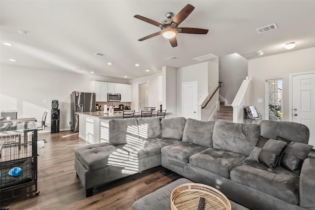 4831 Blue Jacaranda Way, Spring, TX 77373 - living room featuring stairway, wood finished floors, ceiling fan, recessed lighting, and baseboards