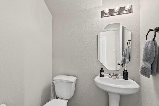 4831 Blue Jacaranda Way, Spring, TX 77373 - half bathroom featuring toilet and a sink