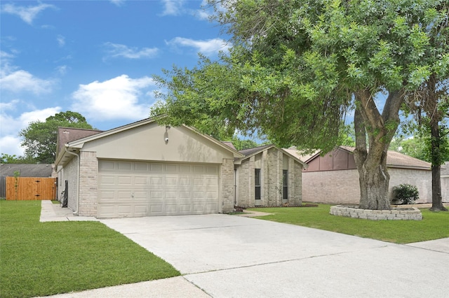 8118 Wind Forest Dr, Houston, TX 77040 - view of front of home with a garage, concrete driveway, brick siding, and stucco siding