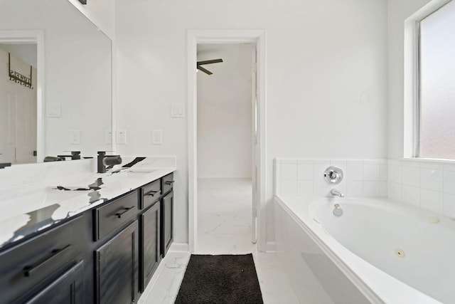 6519 Portlick Dr, Katy, TX 77449 - full bathroom with marble finish flooring, vanity, and a whirlpool tub