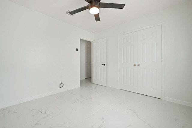 6519 Portlick Dr, Katy, TX 77449 - unfurnished bedroom featuring light marble finish flooring, a closet, and ceiling fan