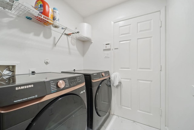 6519 Portlick Dr, Katy, TX 77449 - laundry area with light marble finish floors and independent washer and dryer