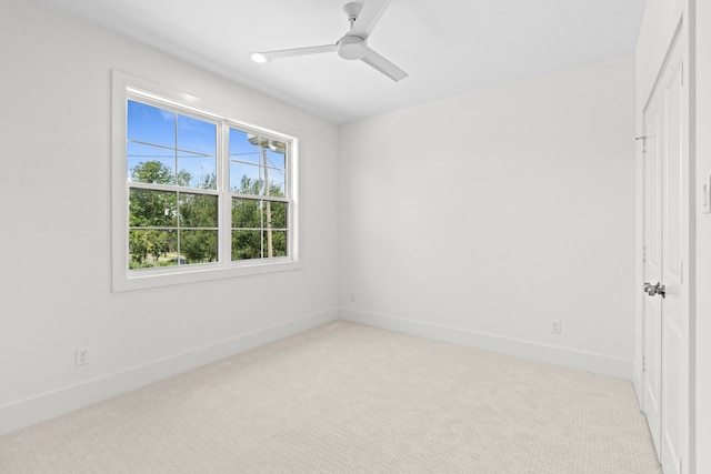 937 Louise St, Houston, TX 77009 - unfurnished bedroom with light colored carpet, baseboards, and a ceiling fan
