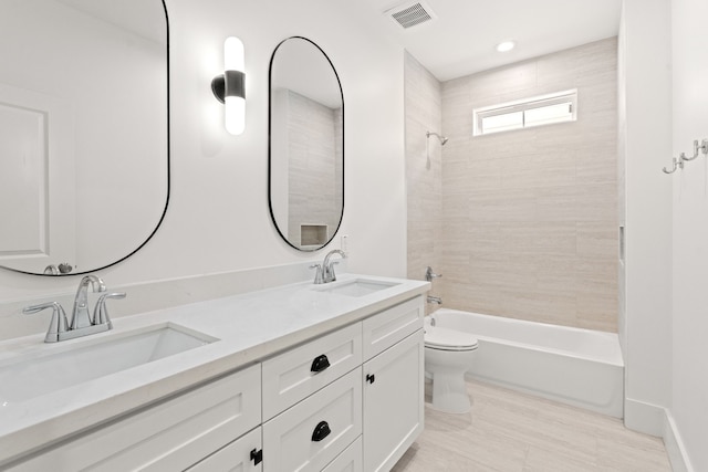 937 Louise St, Houston, TX 77009 - full bath with toilet, double vanity, and washtub / shower combination
