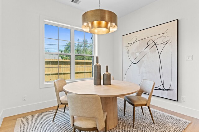 937 Louise St, Houston, TX 77009 - dining room featuring light wood-style floors and baseboards