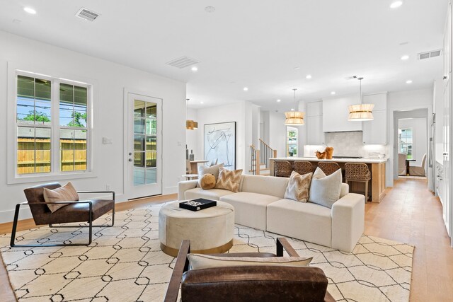 937 Louise St, Houston, TX 77009 - living area with light wood-style floors, healthy amount of natural light, and recessed lighting