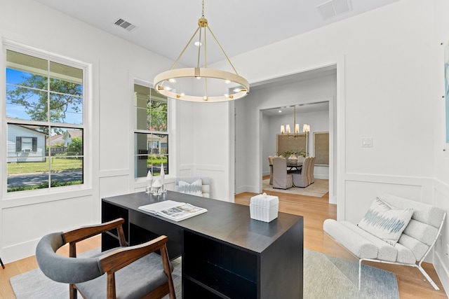 937 Louise St, Houston, TX 77009 - office featuring a chandelier, wood finished floors, and a decorative wall