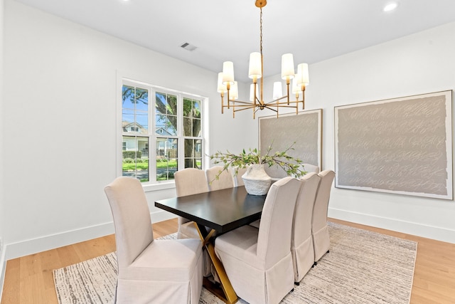 937 Louise St, Houston, TX 77009 - dining area featuring a chandelier, wood finished floors, recessed lighting, and baseboards