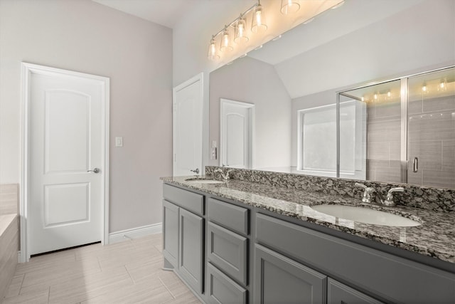 3823 Ponderosa Peak Dr, Spring, TX 77386 - bathroom with double vanity, a stall shower, lofted ceiling, and baseboards