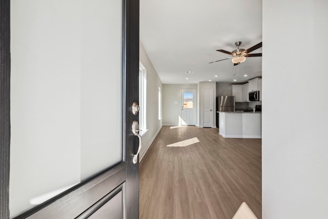 412 Tejas Trl, Waller, TX 77484 - entryway with light wood finished floors, a ceiling fan, recessed lighting, and baseboards