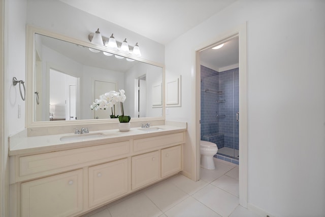 1918 Prospect St, Houston, TX 77004 - bathroom with tile patterned flooring, double vanity, and a shower stall