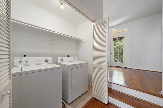 1918 Prospect St, Houston, TX 77004 - washroom featuring washer and clothes dryer and light wood-style floors