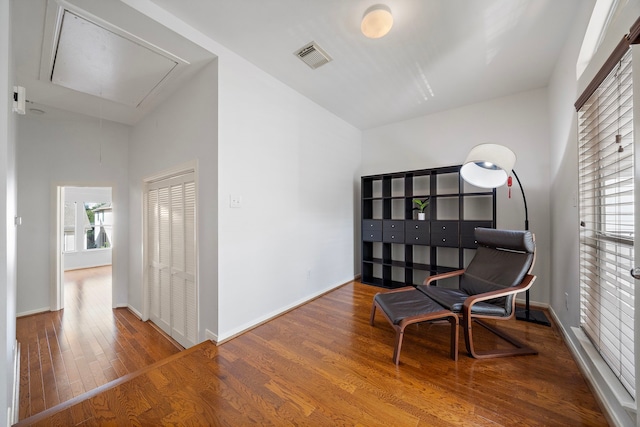 1918 Prospect St, Houston, TX 77004 - sitting room featuring attic access and wood finished floors