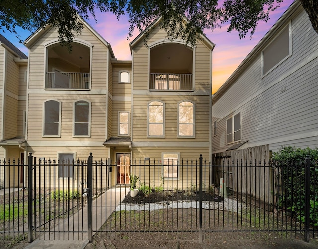 1918 Prospect St, Houston, TX 77004 - view of property featuring a balcony and a fenced front yard