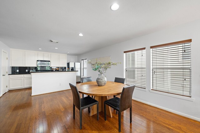 1918 Prospect St, Houston, TX 77004 - dining space featuring dark wood-style flooring and recessed lighting