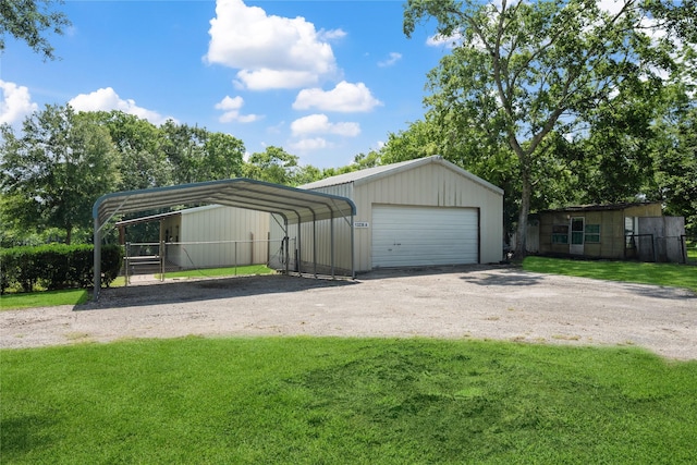 13236 Fm 1409 Unit A, Dayton, TX 77535 - detached garage featuring dirt driveway and a detached carport