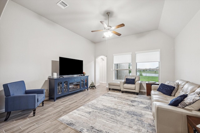 24214 Golden Fallow Dr, Katy, TX 77493 - living area with light wood-style flooring, a ceiling fan, arched walkways, and vaulted ceiling