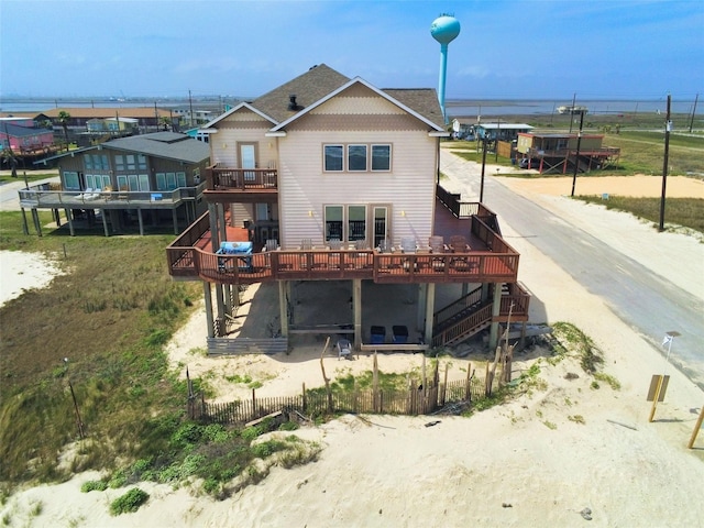 107 Yucca Ave, Surfside Beach, TX 77541 - rear view of property with a deck