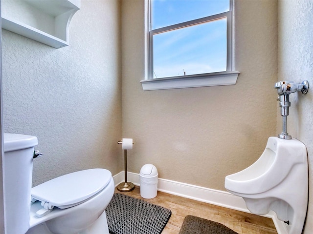 107 Yucca Ave, Surfside Beach, TX 77541 - half bathroom featuring toilet, wood finished floors, and baseboards