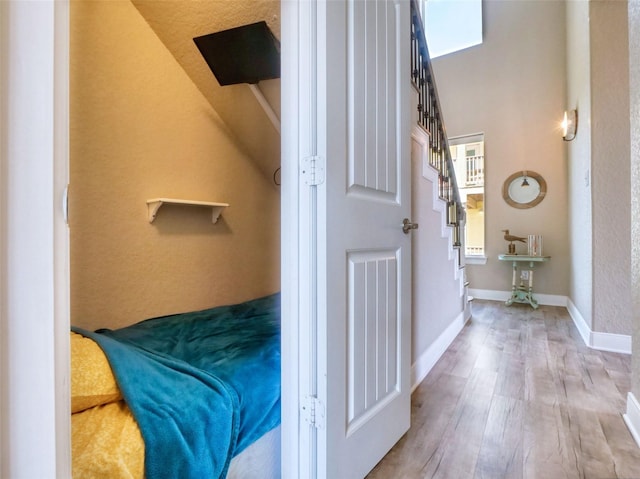 107 Yucca Ave, Surfside Beach, TX 77541 - bedroom featuring wood finished floors and baseboards