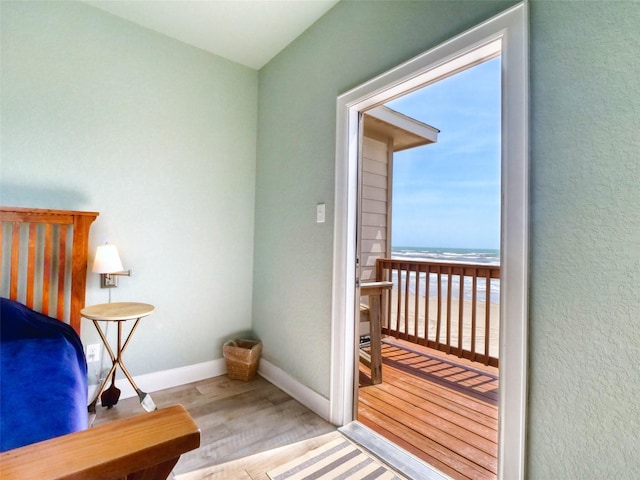 107 Yucca Ave, Surfside Beach, TX 77541 - bedroom with wood finished floors, baseboards, and a water view