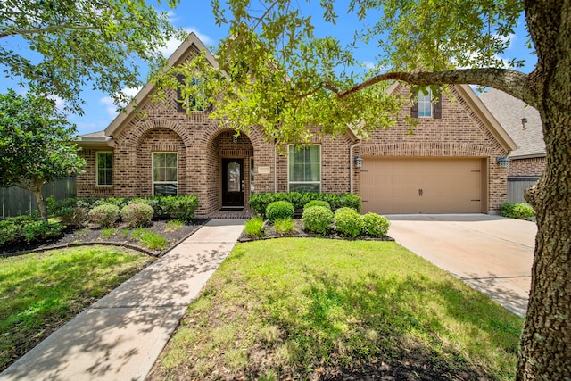 3307 Blueberry Turn Trl, Richmond, TX 77406 - traditional-style home featuring brick siding, concrete driveway, a garage, and a front yard