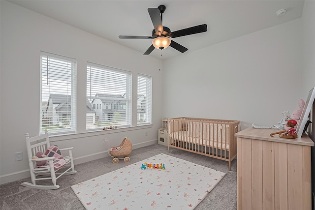 16819 Chapel Knox Dr, Humble, TX 77346 - bedroom with carpet floors, a nursery area, baseboards, and ceiling fan