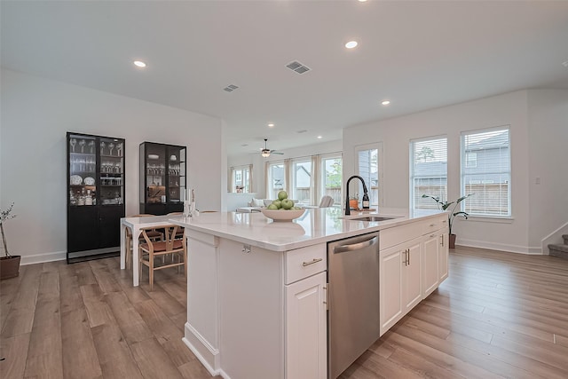 16819 Chapel Knox Dr, Humble, TX 77346 - kitchen with dishwasher, a sink, light wood-style flooring, light countertops, and recessed lighting