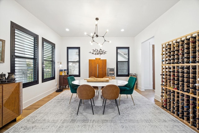 4731 Park Dr, Houston, TX 77023 - dining space featuring a chandelier, plenty of natural light, wood finished floors, and recessed lighting