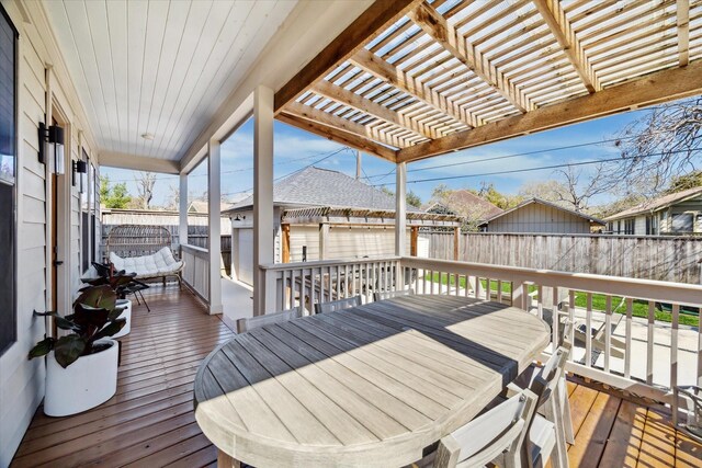 4731 Park Dr, Houston, TX 77023 - wooden deck with a fenced backyard, a pergola, outdoor dining space, and an outbuilding