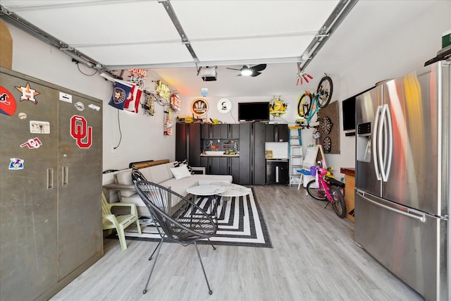 4731 Park Dr, Houston, TX 77023 - garage with stainless steel fridge with ice dispenser and a garage door opener