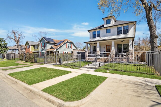 4731 Park Dr, Houston, TX 77023 - american foursquare style home with covered porch, a gate, and a residential view
