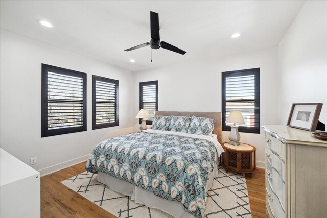 4731 Park Dr, Houston, TX 77023 - bedroom featuring light wood finished floors, baseboards, recessed lighting, and a ceiling fan