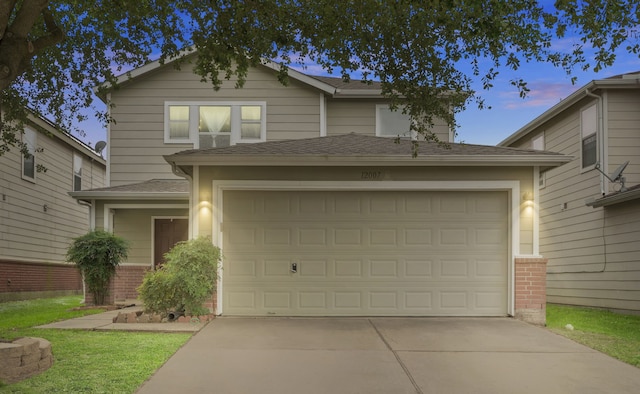 12007 Bach Orchard Trl, Houston, TX 77038 - traditional-style home featuring concrete driveway, roof with shingles, and a garage