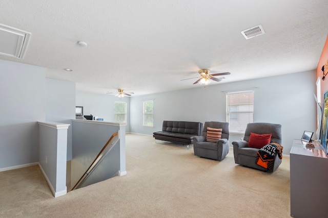 12007 Bach Orchard Trl, Houston, TX 77038 - living area with attic access, light carpet, ceiling fan, and baseboards