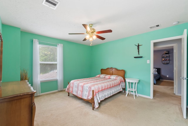 12007 Bach Orchard Trl, Houston, TX 77038 - bedroom featuring light colored carpet, baseboards, and a ceiling fan