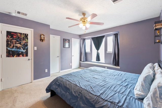 12007 Bach Orchard Trl, Houston, TX 77038 - bedroom with carpet, a textured ceiling, ceiling fan, and baseboards