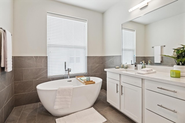 3037 Hicks St, Houston, TX 77007 - full bath with tile walls, vanity, healthy amount of natural light, a freestanding bath, and a wainscoted wall